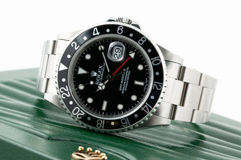 Rolex GMT Master II - 16710 in it sitting on top of the box